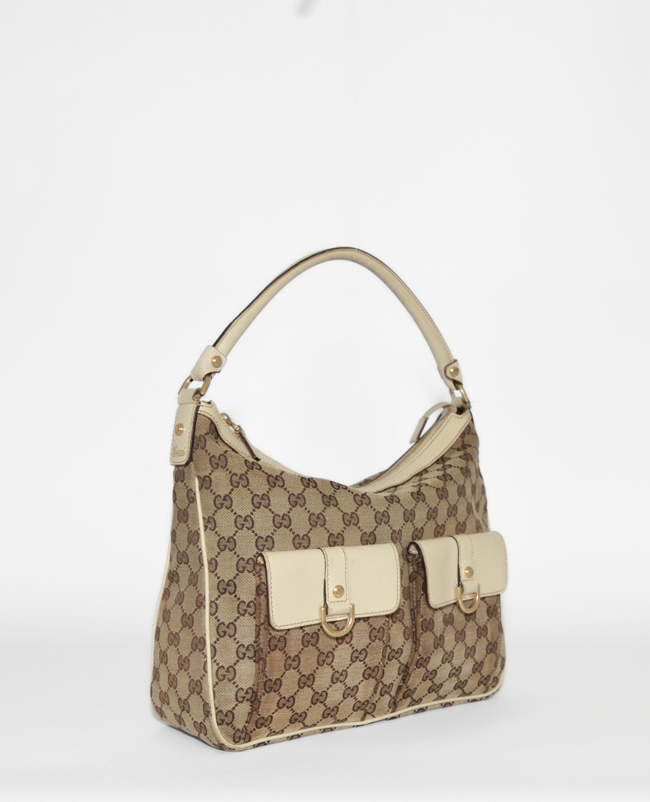 Vintage luxury Gucci Abbey Hobo Bag in beige monogram canvas with cream leather trim and front pockets, high-end authentic. - Gucci GG Canvas Abbey Hobo Bag