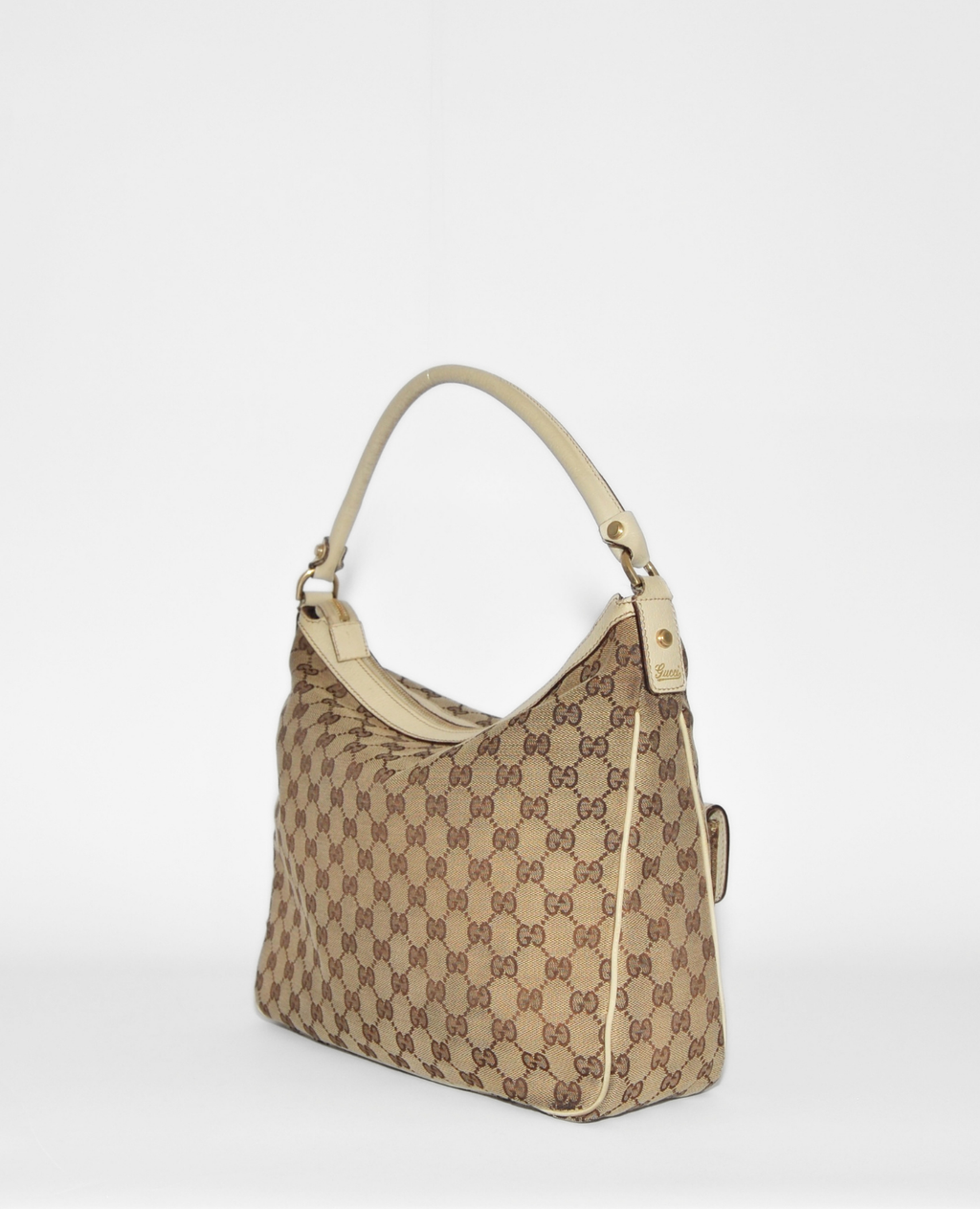 Gucci Abbey hobo bag in vintage luxury monogram canvas with beige leather trim and single shoulder strap. - Gucci GG Canvas Abbey Hobo Bag