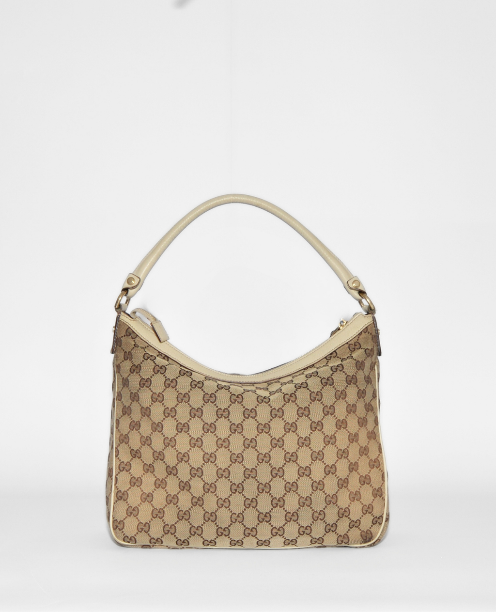 Gucci vintage luxury monogram GG canvas Abbey hobo bag with beige leather trim and gold hardware. - Gucci GG Canvas Abbey Hobo Bag