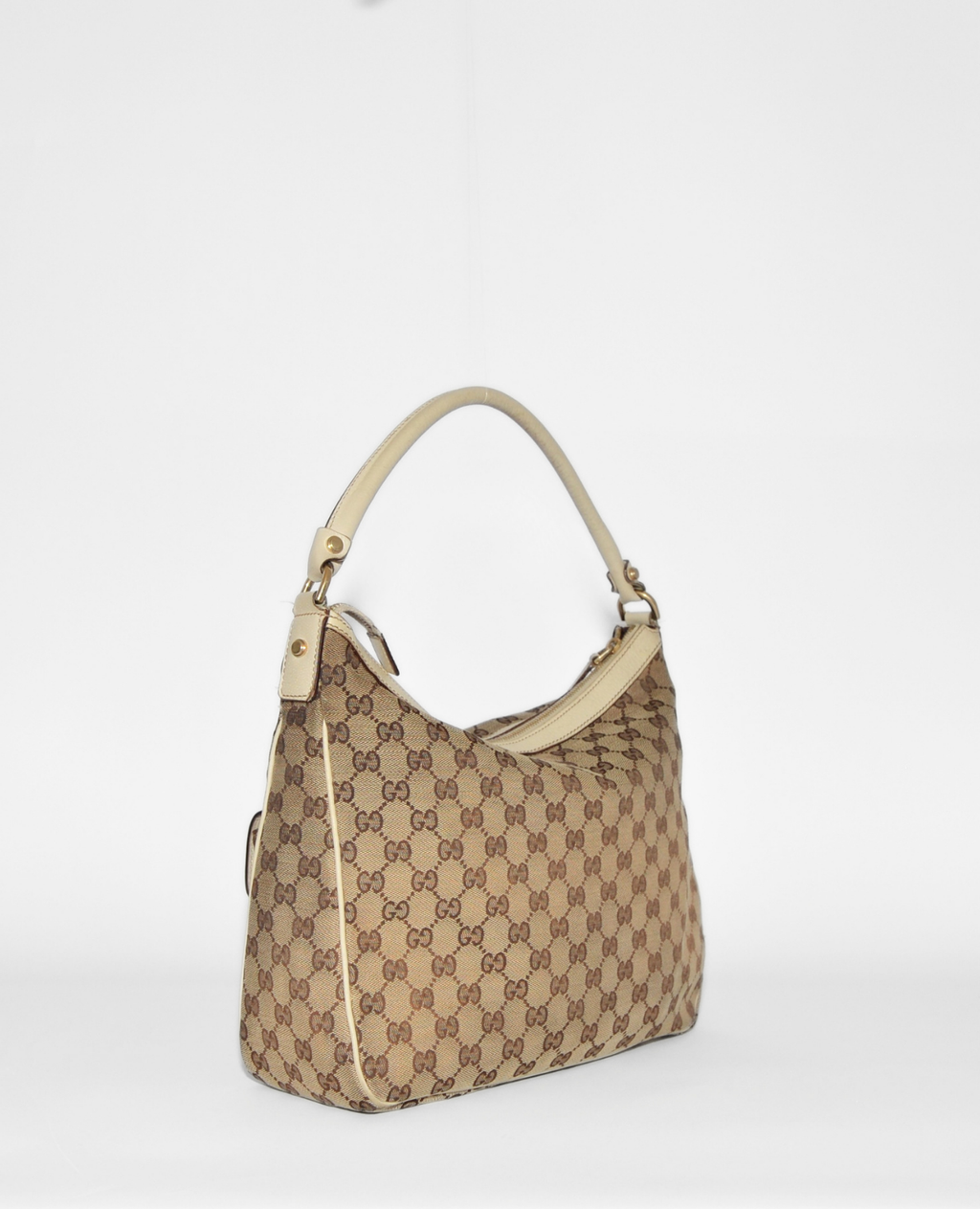 Vintage luxury Gucci GG Canvas Abbey Hobo Bag with authentic monogram, beige leather trim, and rare high-end design. - Gucci GG Canvas Abbey Hobo Bag