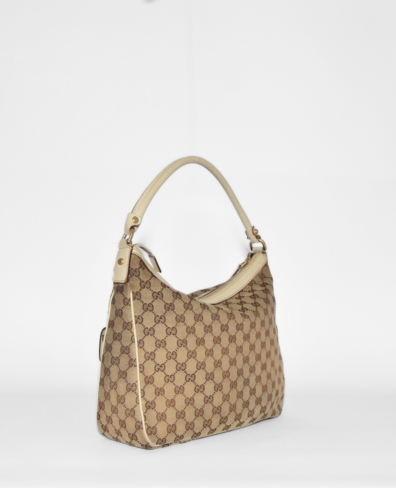 Vintage luxury Gucci GG Canvas Abbey Hobo Bag with authentic monogram, beige leather trim, and rare high-end design. - Gucci GG Canvas Abbey Hobo Bag