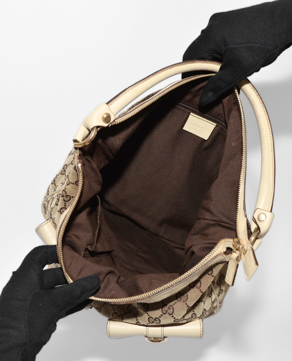 Open vintage luxury Gucci GG Canvas Abbey Hobo Bag showing spacious brown fabric interior, monogram canvas exterior, and. - Gucci GG Canvas Abbey Hobo Bag