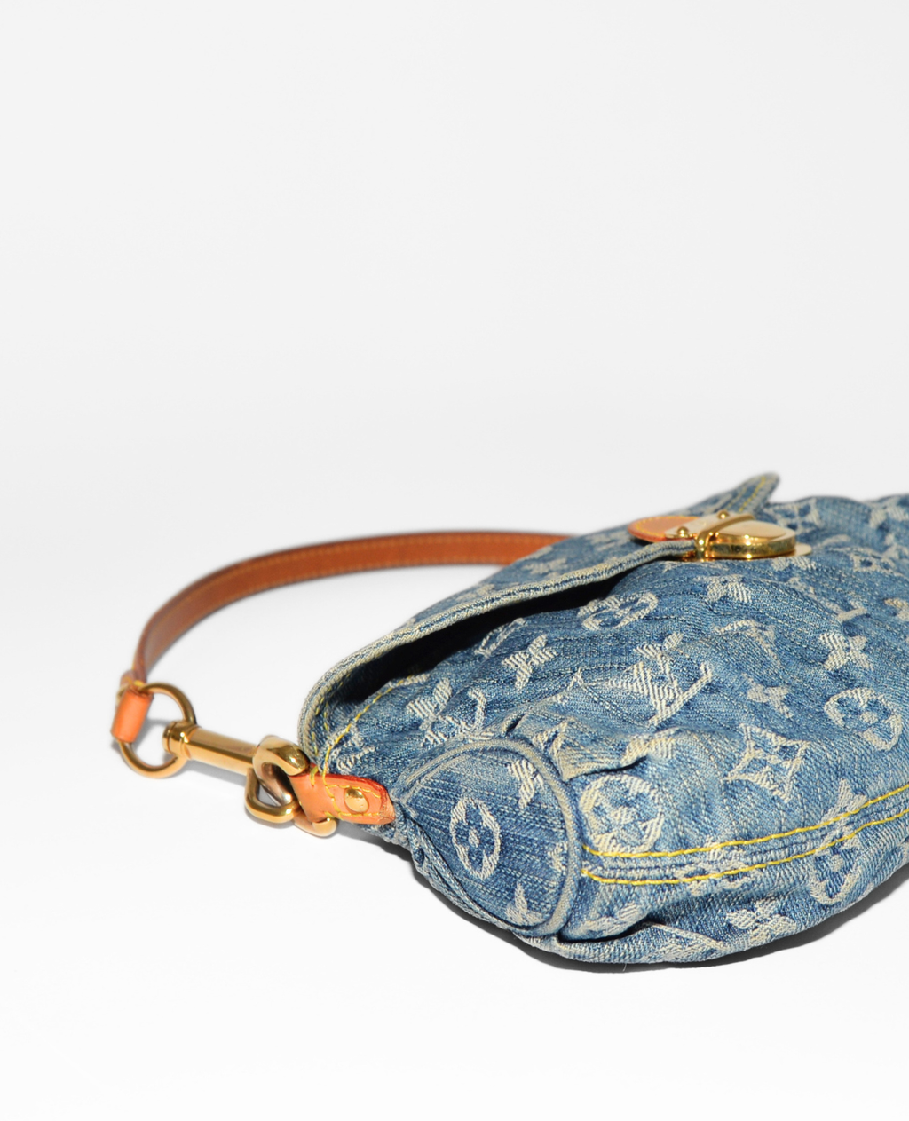 Louis Vuitton Pleaty denim shoulder bag with vintage luxury monogram and leather strap, authentic high-end design. - Louis Vuitton Pleaty Denim Shoulder Bag
