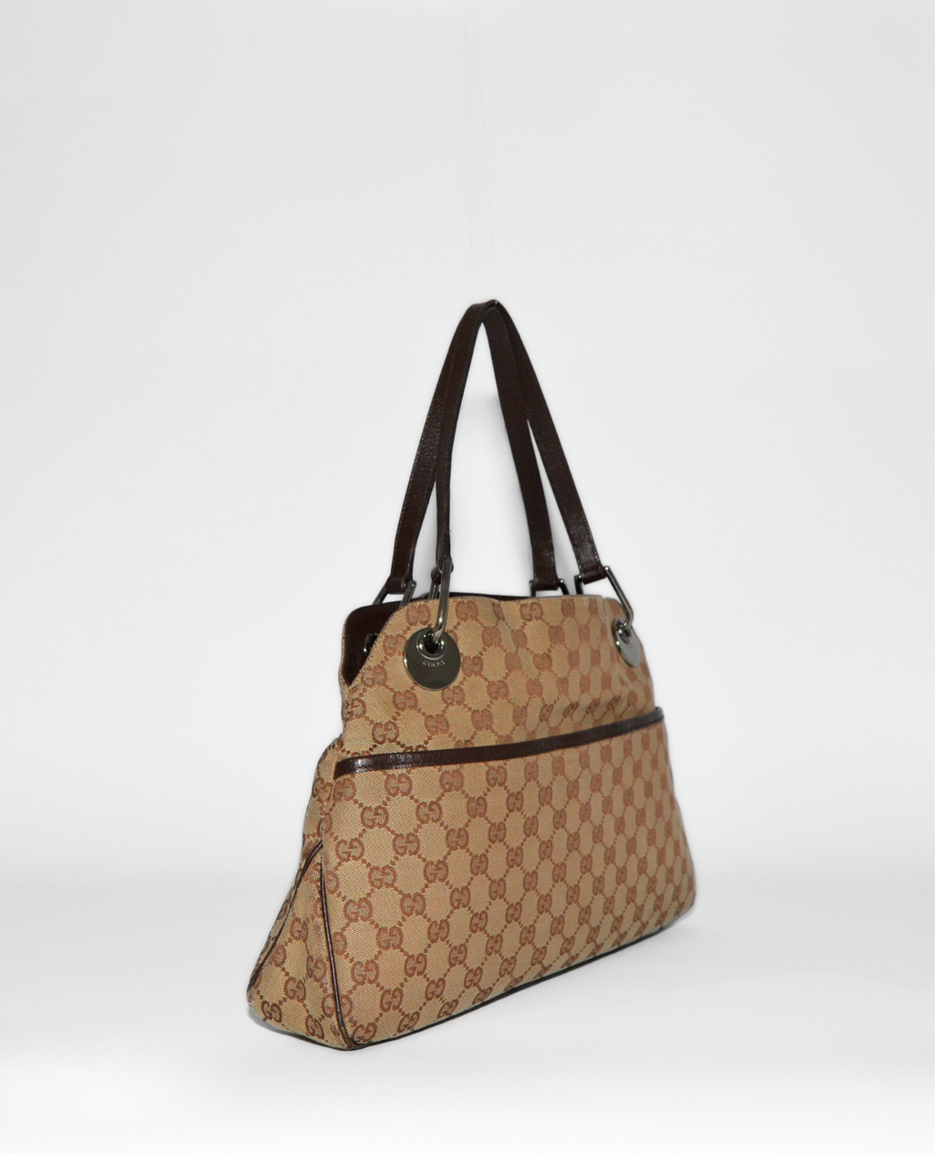 Gucci vintage luxury shoulder bag with iconic GG monogram canvas and dark brown leather straps, authentic high-end design. - Gucci GG Canvas Eclipse Shoulder Bag
