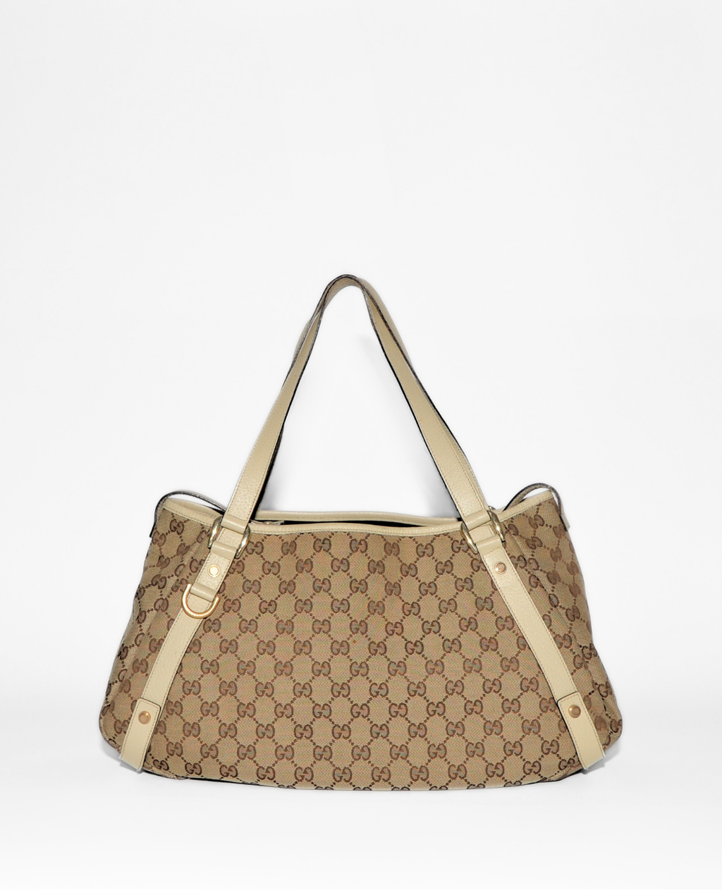 Beige and brown Gucci GG monogram canvas tote bag with tan leather straps and vintage luxury design. - Gucci GG Canvas Abbey Tote Bag
