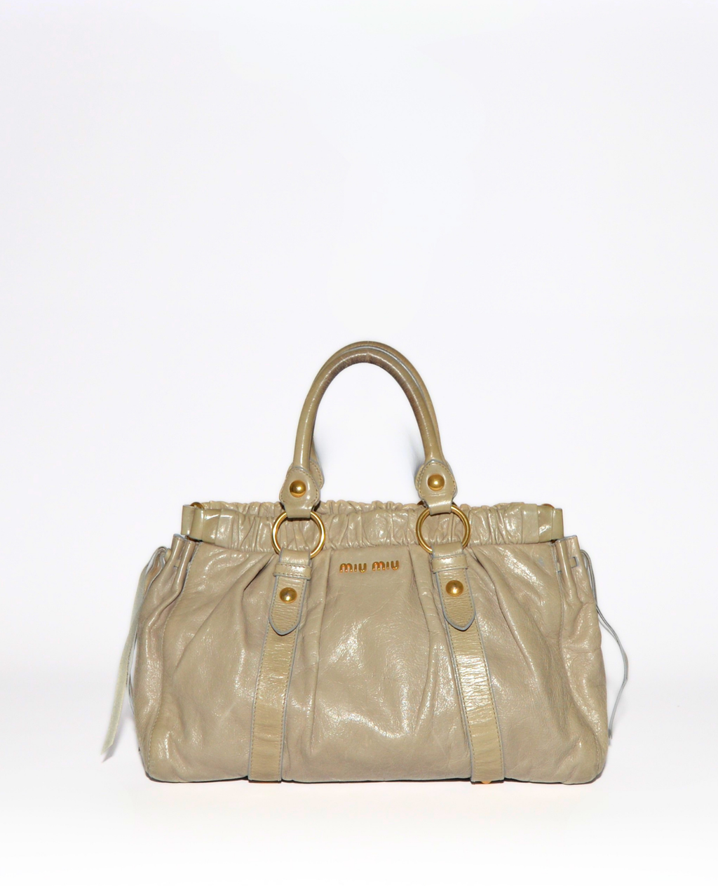 Beige vintage luxury Miu Miu Vitello leather handbag with gold hardware and subtle monogram detailing. - Miu Miu Vitello Leather Handbag