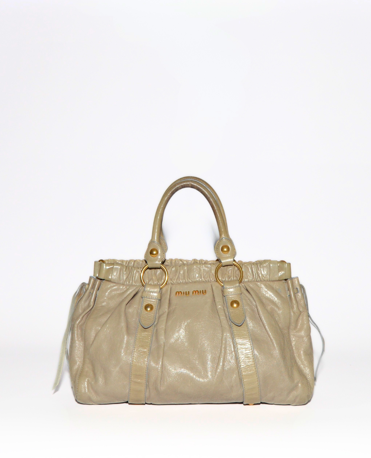 Beige vintage luxury Miu Miu Vitello leather handbag with gold hardware and subtle monogram detailing. - Miu Miu Vitello Leather Handbag