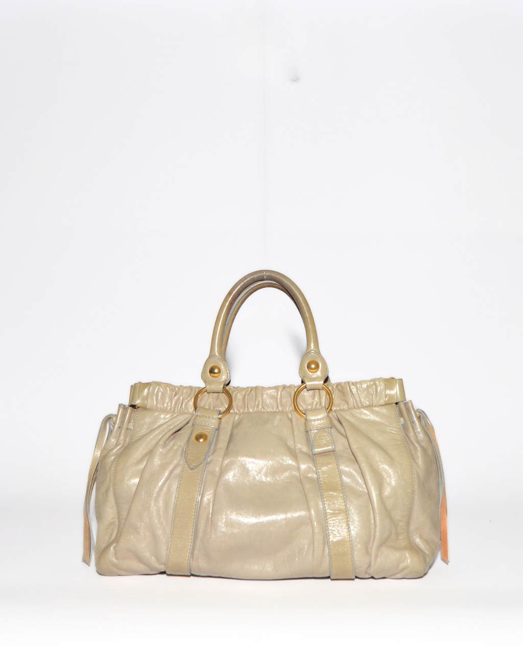 Vintage luxury Miu Miu Vitello leather handbag in soft beige with gathered detailing and gold-tone hardware. - Miu Miu Vitello Leather Handbag