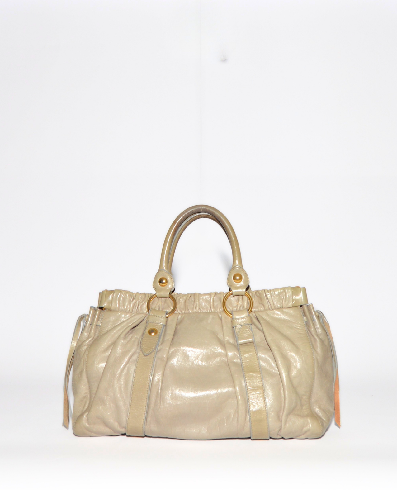 Vintage luxury Miu Miu Vitello leather handbag in soft beige with gathered detailing and gold-tone hardware. - Miu Miu Vitello Leather Handbag