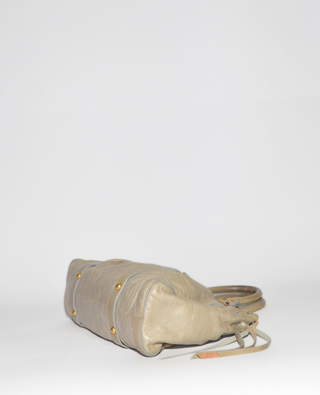 Beige vintage luxury Miu Miu Vitello leather handbag with gold-tone studs and monogrammed high-end design. - Miu Miu Vitello Leather Handbag