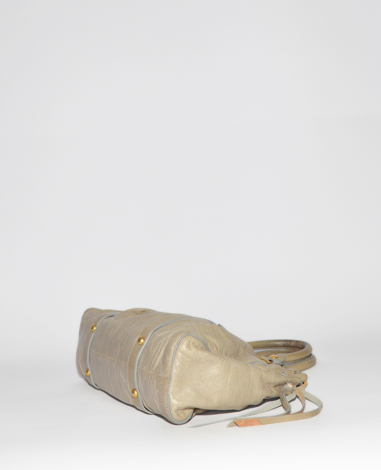 Beige vintage luxury Miu Miu Vitello leather handbag with gold-tone studs and monogrammed high-end design. - Miu Miu Vitello Leather Handbag
