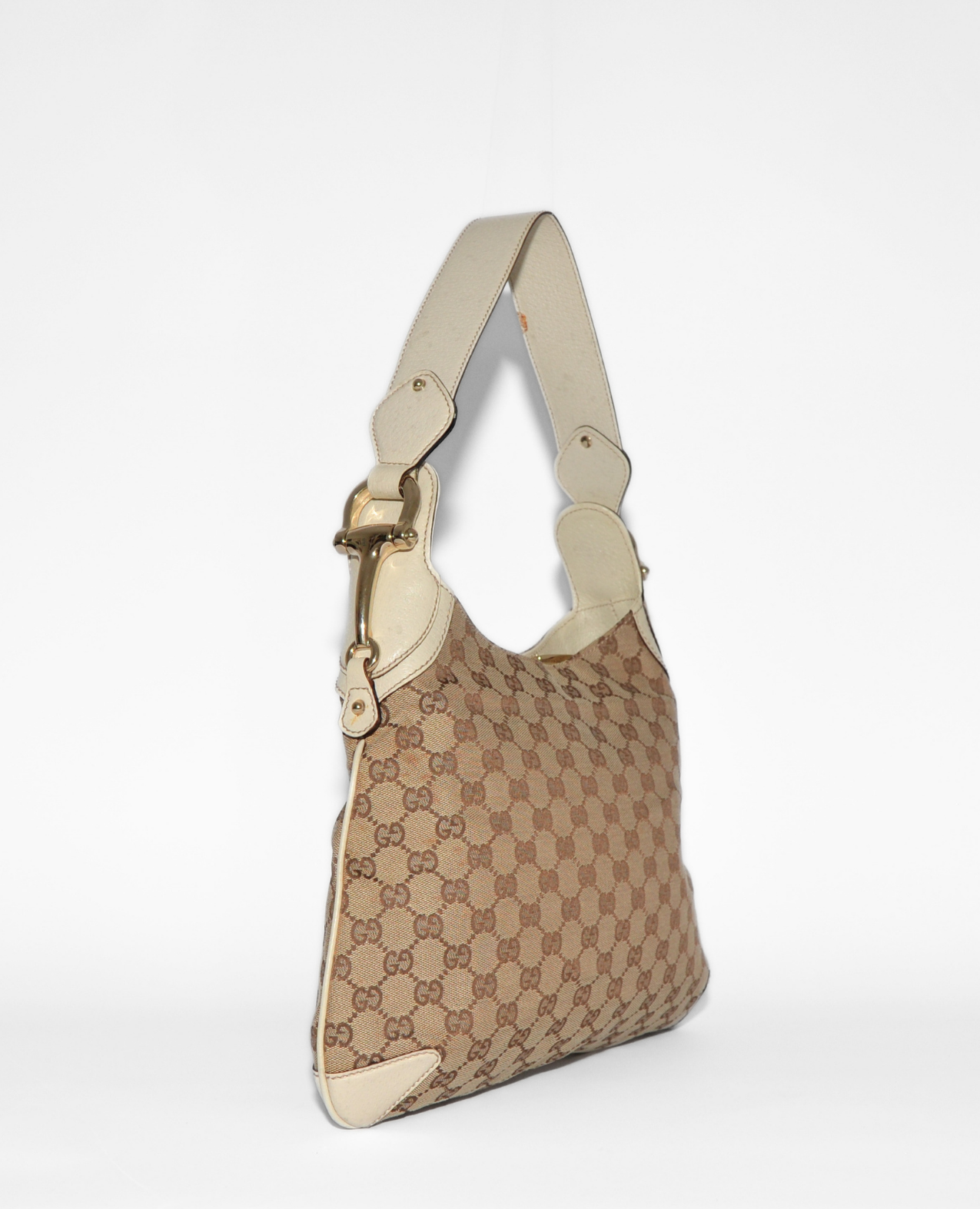 Vintage luxury Gucci GG canvas shoulder bag with monogram and authentic gold horsebit detail. - Gucci GG Canvas Horsebit Shoulder Bag