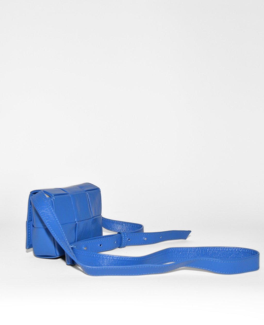 Blue leather Bottega Veneta Mini Cassette crossbody bag with signature intrecciato weave, vintage luxury and high-end. - Bottega Veneta Mini Casette Crossbody Bag