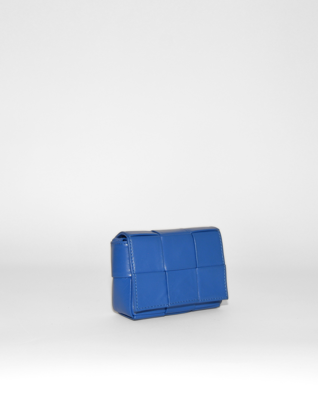Blue woven leather Bottega Veneta Mini Cassette crossbody bag with high-end vintage luxury design. - Bottega Veneta Mini Casette Crossbody Bag
