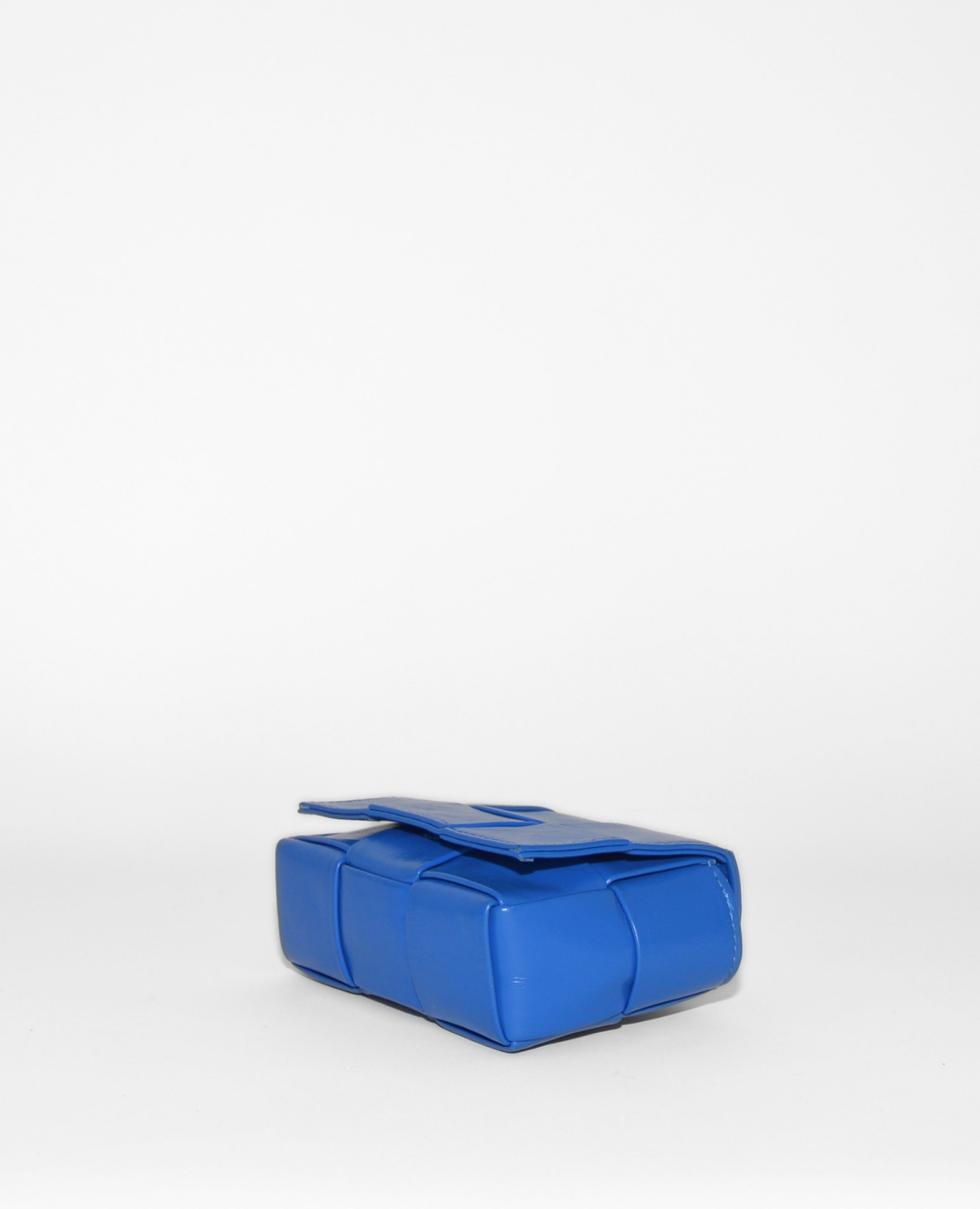 Bright blue Bottega Veneta Mini Cassette crossbody bag with emblematic woven leather design, vintage luxury feel, and. - Bottega Veneta Mini Casette Crossbody Bag