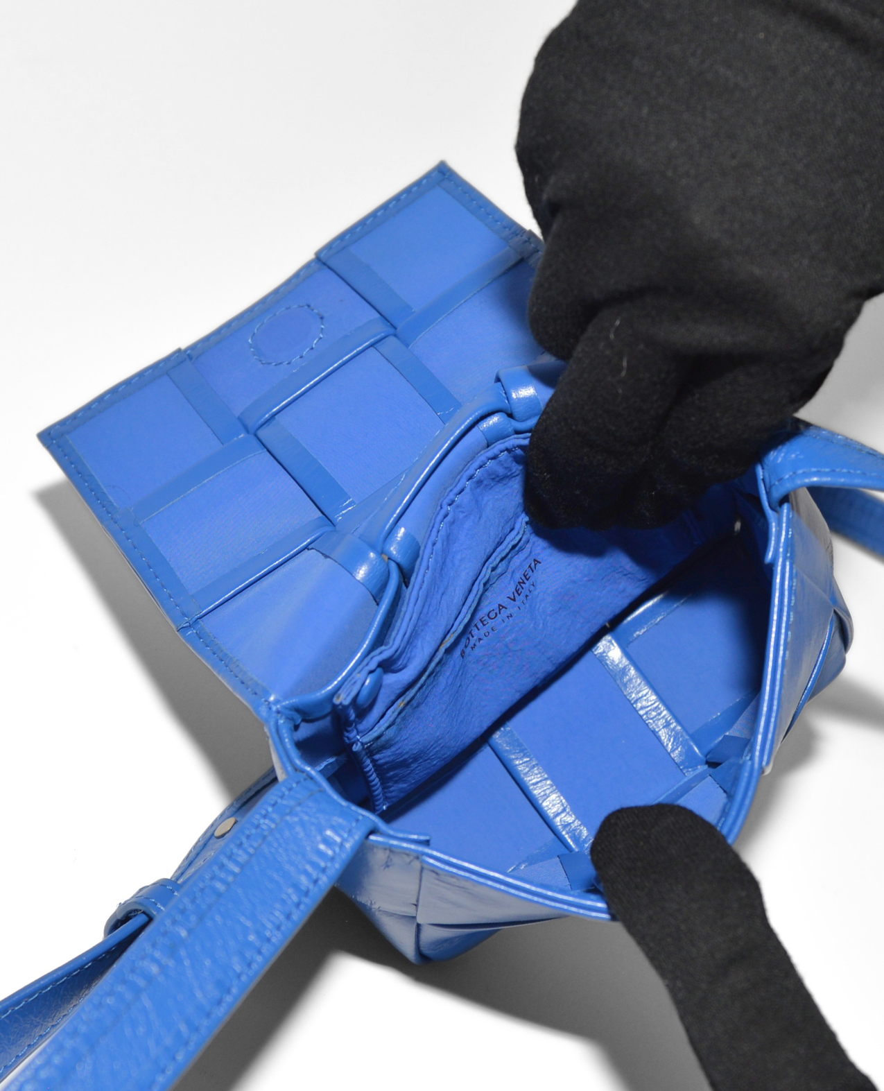 Blue leather Bottega Veneta Mini Casette crossbody bag with signature woven monogram and zipper pocket, showcasing vintage. - Bottega Veneta Mini Casette Crossbody Bag