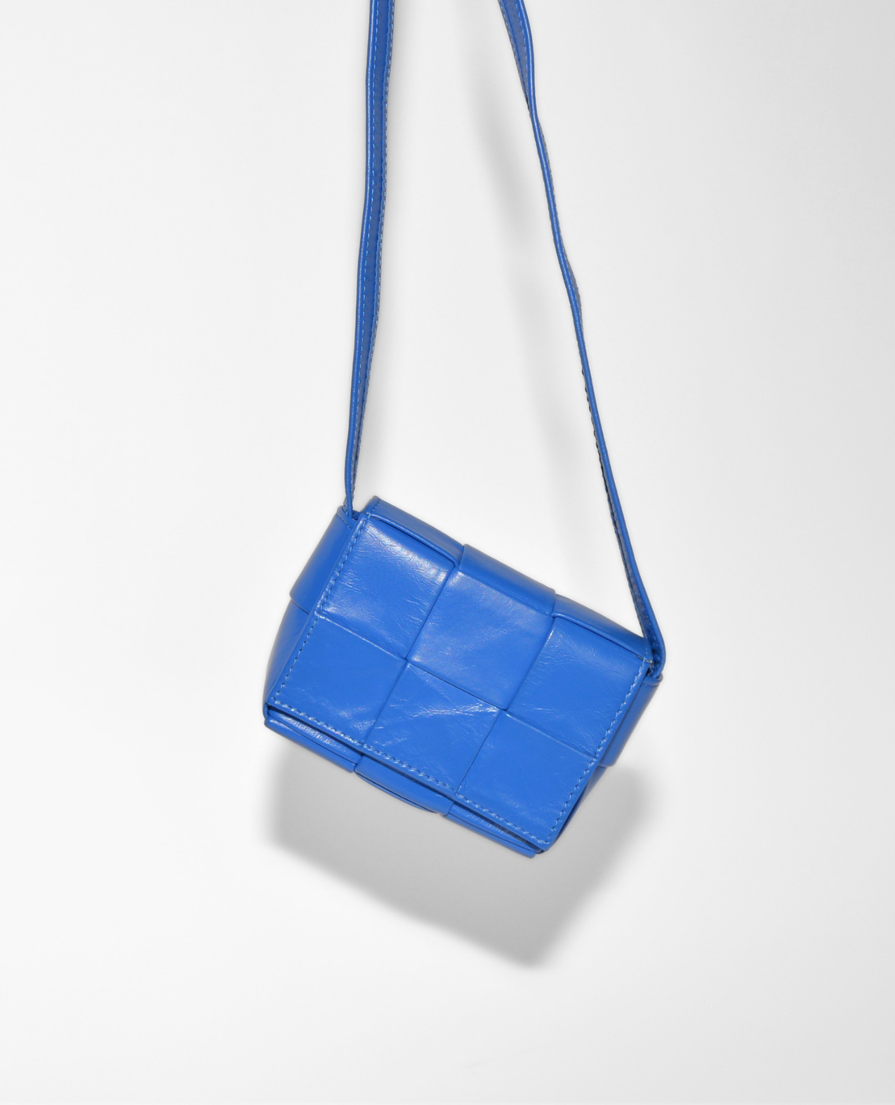 Blue Bottega Veneta Mini Cassette crossbody bag with padded leather and vintage luxury style. - Bottega Veneta Mini Casette Crossbody Bag